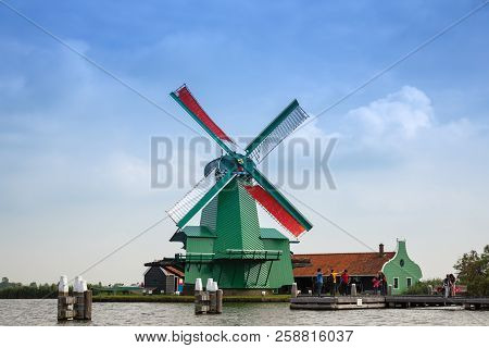 Zaanse Schans, Netherlands, August 19, 2015 - Traditional, Authentic Dutch Windmill At The River Zaa