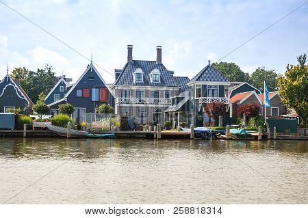 Zaanse Schans, Netherlands, August 19, 2015 - Traditional Dutch Houses And Boats At The Canal.