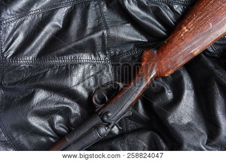 Ancient Hunting Shotgun Closeup On Black Leather Background