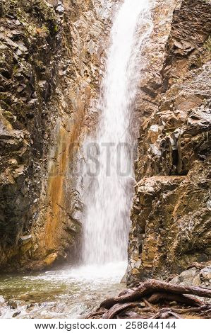 Autumn Waterfall With Rocks And Leaves In Troodos Mountains In Cyprus