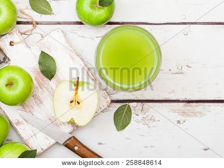 Glass Of Fresh Organic Apple Juice With Granny Smith And British Bramley Apples On Wooden Background