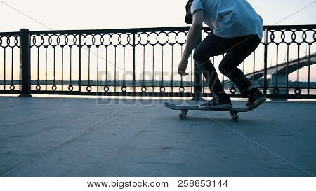 Man Skates On A Skateboard And Tries To Do A Kickflip Trick And Fails, Slow Motion