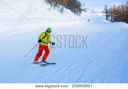 Image Of Sports Man Skiing On Snowy Slope During Day