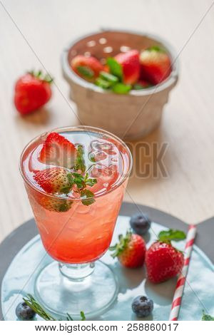 Strawberry Juice Mixed With Soda On Wooden Background