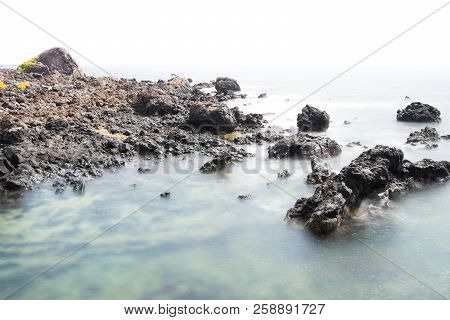 View Of The Coast Of Lanzarote Formed Mostly By Cooled Lava During A Sunny Day.