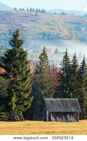 Morning Fog, Colorful Trees And Wooden Shed On The Slopes Of The Carpathian Mountains (yablunytsia V