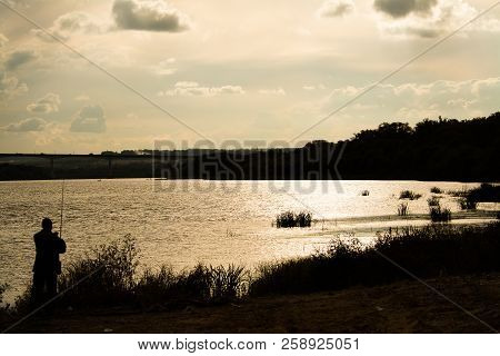 The Fisherman Catches Fish By Fly Fishing