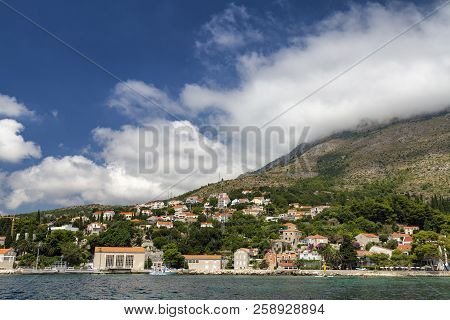 The Town Of Mlini In Croatia With Clouds In The Background.