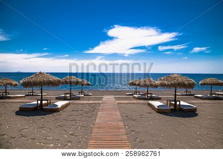 Permissa black sand beach in Santorini. Greece. 