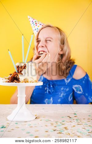 Teenage Girl Eating  Birthday Cake With Her Hands. One Person Party. Concept Of Birthday Party, Mess