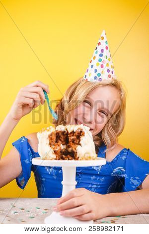 Teenage Girl Enjoying Herself After Ruining Birthday Cake. One Person Party. Concept Of Birthday Par