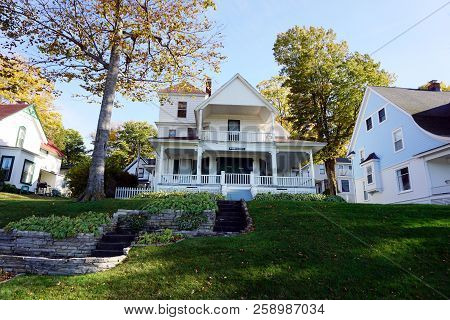 Bay View, Michigan / United States - October 17, 2017: An Elegant White Two Story Victorian Cottage,
