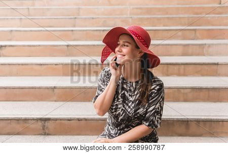Portrait Beautiful Woman Using Smartphone And Sittiing On Stair,happy And Smiling