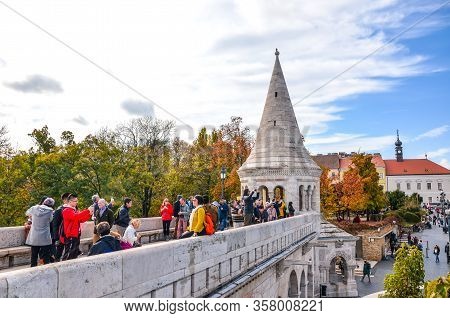 Budapest, Hungary - Nov 6, 2019: Tourists Sightseeing And Taking Photos Of Fishermans Bastion In The