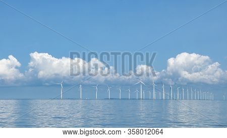 Wind Turbine From Aerial View, Drone View At Windpark Westermeerdijk A Windmill Farm In The Lake Ijs