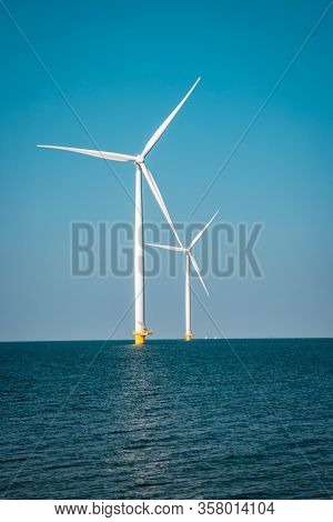 Wind Turbine From Aerial View, Drone View At Windpark Westermeerdijk A Windmill Farm In The Lake Ijs