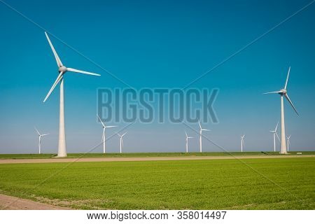 Wind Turbine From Aerial View, Drone View At Windpark Westermeerdijk A Windmill Farm In The Lake Ijs