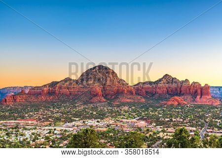 Sedona, Arizona, USA downtown cityscape and mountains.