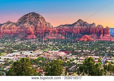 Sedona, Arizona, USA downtown cityscape and mountains.