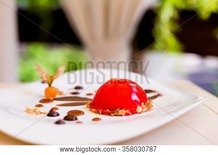 Red Dessert On White Plate At Restaurant