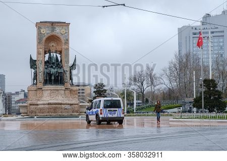 Istanbul, Turkey - 24 March, 2020:  A Police Vehicle Parked In An Empty Taksim Square In Istanbul Am