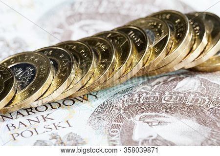 Different Polish Money In Cash In The Form Of Banknotes And Coins, Close-up Of The National Currency