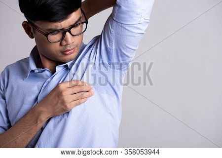 Close Up Asian Man With Hyperhidrosis Sweating. Young Asia Man With Sweat Stain On His Clothes Again