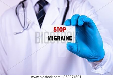 Doctor Holding A Card With Text Stop Migraine Medical Concept