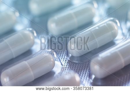 Pack Of Pills Closeup. Diagonal Row Of Oval Long Shape Remedy. Background Or Texture About Medicine,