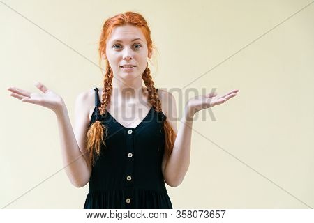 Beautiful Restless Girl Posing On Yellow Background. Turmoil And Fuss Emotion. Economic Crisis Conce