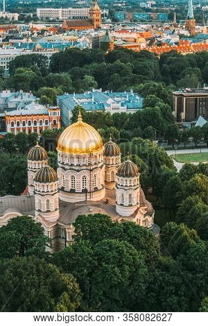 Riga, Latvia. Riga Cityscape. Top View Of Riga Nativity Of Christ Cathedral - Famous Church And Land