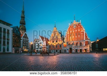 Riga, Latvia - July 1, 2016: Scenic Town Hall Square With St. Peters Church, Schwabe House, House Of