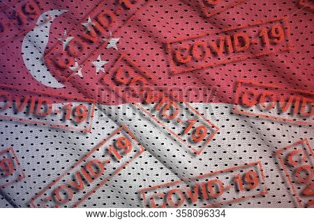 Singapore Flag And Many Red Covid-19 Stamps. Coronavirus Or 2019-ncov Virus Concept