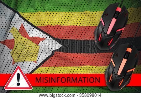 Zimbabwe Flag And Two Computer Mouses. Misinformation During Coronavirus Or 2019-ncov Virus Concept