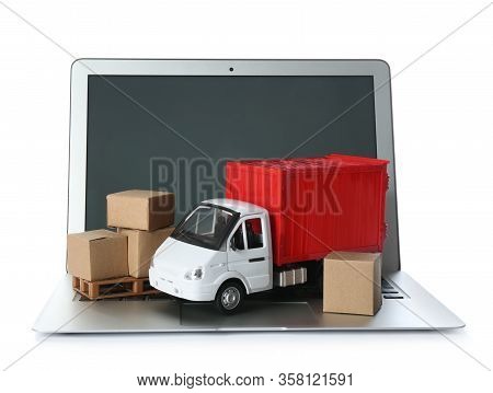 Laptop, Truck Model And Carton Boxes On White Background. Courier Service
