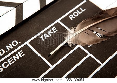 Black Movie Clapper And Fountain Pen Closeup