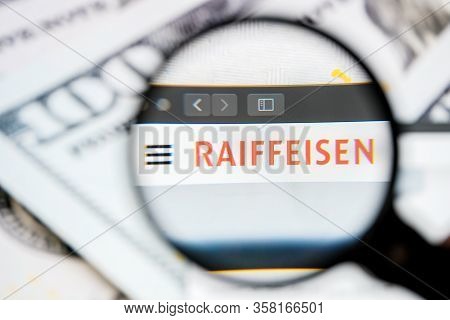 Russia, St.petersburg - August 12, 2020: Logo Raiffeisen Schweiz On The Website Screen Through A Mag