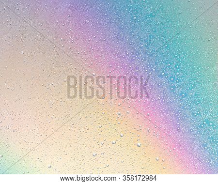 Water Drops On The Glass On A Bright, Colorful Background. Abstract, Soft Focus.