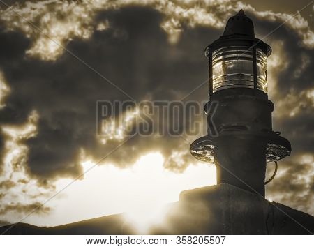 Lighthouse Green Beacon Against Cloudy Sky In Senj Croatia.