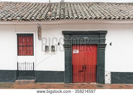 Nemocon, Cundinamarca / Colombia; March 24, 2018: Traditional Construction With A Closed Red Door, F