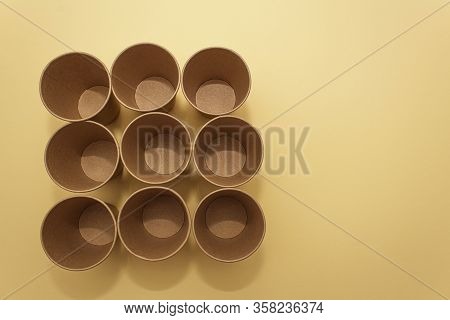 Many Craft Paper Cups For Coffee Or Any Drinks On A  Blue Paper Background. Concept Of Ziro Waste, N