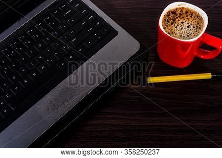 Work For Home, Computer, Solve Coffee Red Paka Yellow On A Wooden Floor New Technology