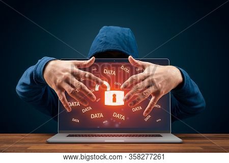 Hacker Usurp Unprotected Computer. Data Leakage And Cybersecurity Concept. Notebook With Symbol Of O