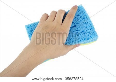 In Hand A Sponge For Cleaning On A White Background, Workhouse Concept. File Contains Clipping Path.