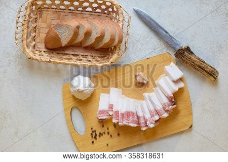 Flat Lay Of Food Composition, Cutting Board With Ukrainian Food, Lard, Garlic And Peppercorn, Having