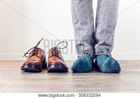 Classic Brown Mens Brogues Shoes And A Man In Blue Socks. Mens Stylish Look.