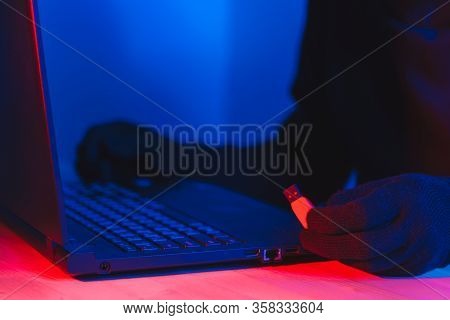 Online Theft Of Personal Data, Computer Hacking. Hacker Man Using A Laptop Attacks The Web. Personal