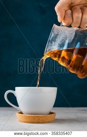 Coffee In Pour Over, Filter Coffee, A Glass Teapot In Hand .alternative Method Brewing