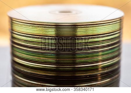 Lot Of Old Cds Stacked On The Windowsill