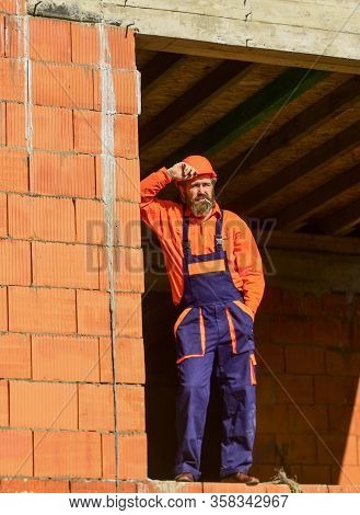 Regular Day. Daily Routine At Construction. Well Done. Repairman Tired Builder Relaxing At Construct
